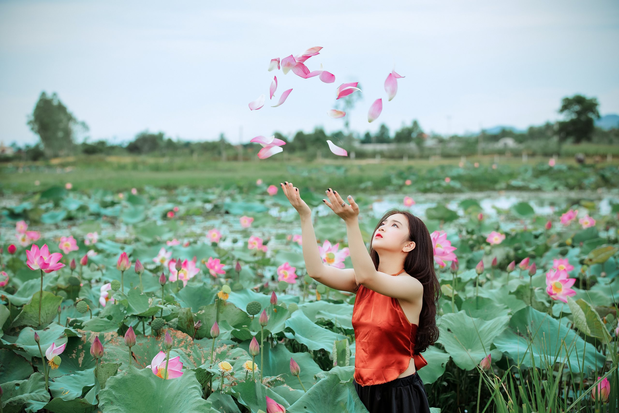 woman-throwing-pink-petals